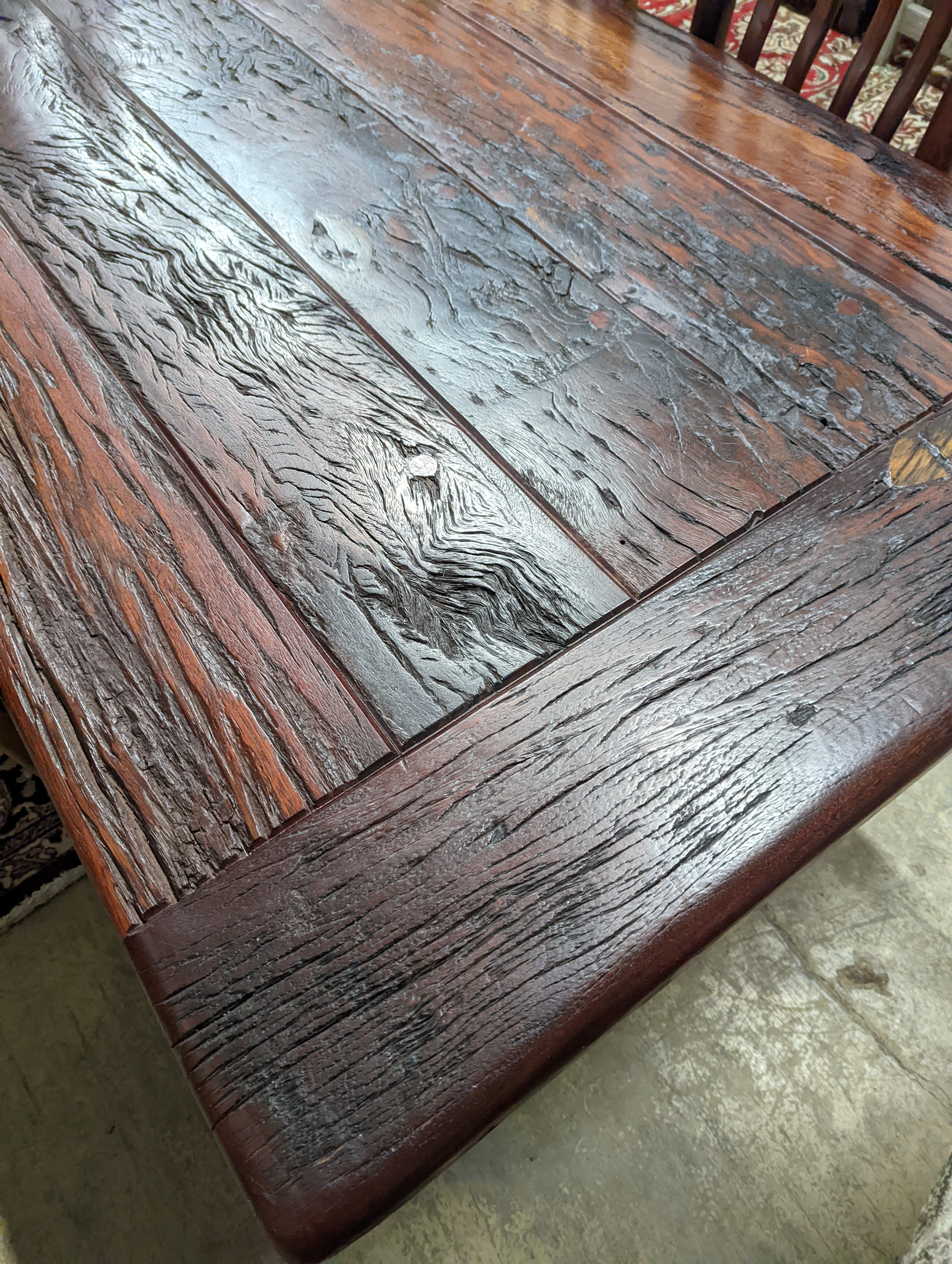 A South African distressed hardwood rectangular refectory dining table, length 200cm, depth 100cm, height 75cm and eight hardwood high back wood seat dining chairs